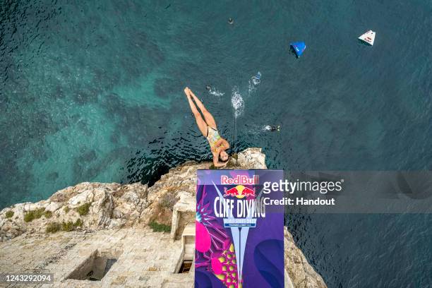 In this handout image provided by Red Bull, Iris Schmidbauer of Germany dives from the 22 competition day of the seventh stop of the Red Bull Cliff...