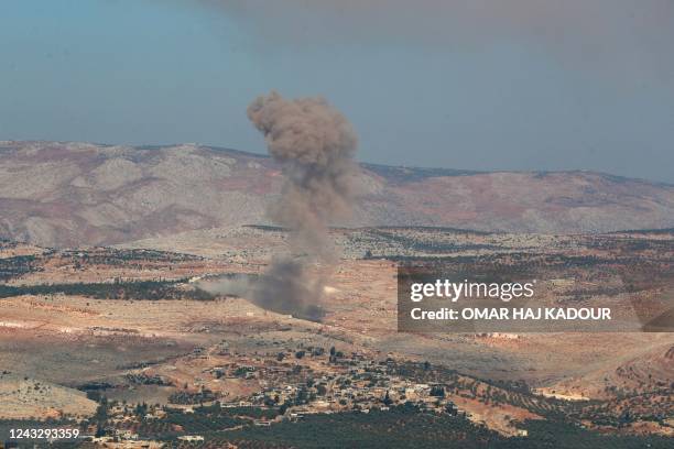 Smoke billows, following a reported airstrike, near Syria's rebel-held northwestern city of Idlib on September 17, 2022.