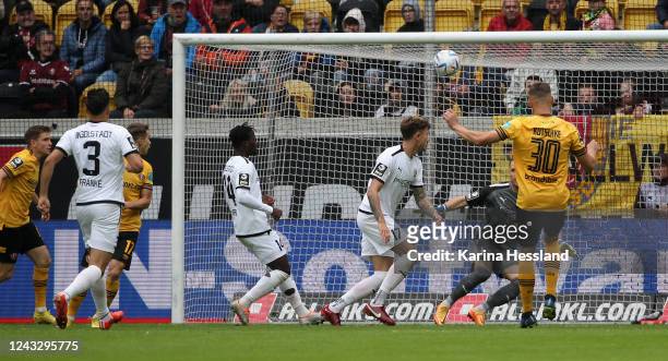 Stefan Kutschke of Dresden scores the opening goal, Goalkeeper Marius Funk of Ingolstadt without a chance during the 3.Liga match between SG Dynamo...