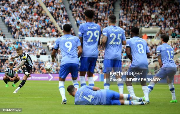 Newcastle United's English defender Kieran Trippier takes a free kick after a foul on Newcastle United's Brazilian midfielder Bruno Guimaraes during...