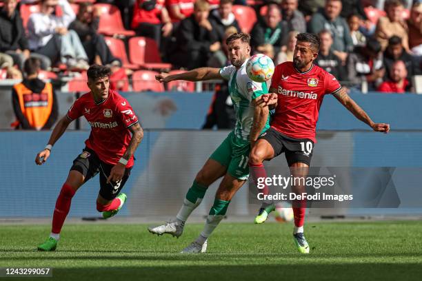 Piero Hincapie of Bayer 04 Leverkusen, Niclas Fuellkrug of SV Werder Bremen and Kerem Demirbay of Bayer 04 Leverkusen battle for the ball during the...