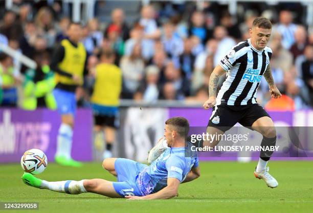 Bournemouth's Scottish midfielder Ryan Christie tackles Newcastle United's English defender Kieran Trippier during the English Premier League...