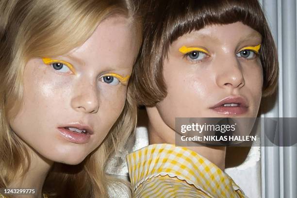 Models pose for pictures in the backstage prior to the Paul & Joe Spring/Summer 2023 catwalk show on the third day of London Fashion Week June...