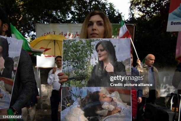 September 2022, Berlin: Members of the National Council of Resistance of Iran demonstrate in front of the Iranian Embassy in Berlin. The occasion for...