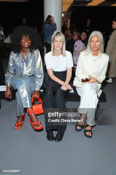 Deborah Ababio, Laura Ingham and Deputy Editor of British Vogue Sarah Harris attend the Huishan Zhang show during London Fashion Week September 2022...