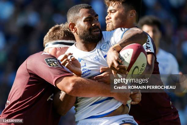 Castres' Fijian centre Adrea Cocagi attempts an off-load pass during the French Top14 rugby union match between Union Bordeaux-Begles and Castres...