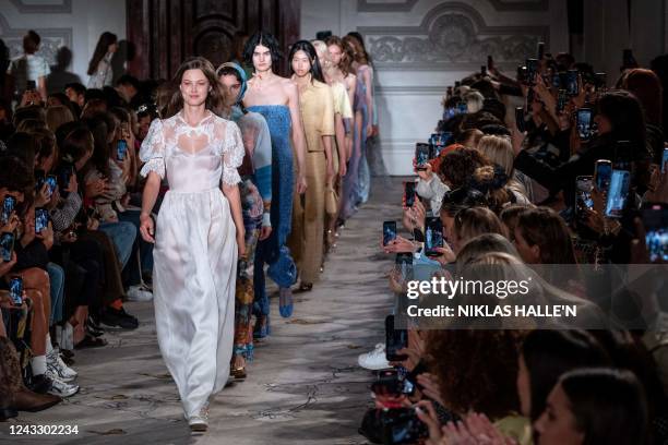 Models present creations for Paul & Joe at the end of the Spring/Summer 2023 catwalk show on the third day of London Fashion Week June Edition, in...