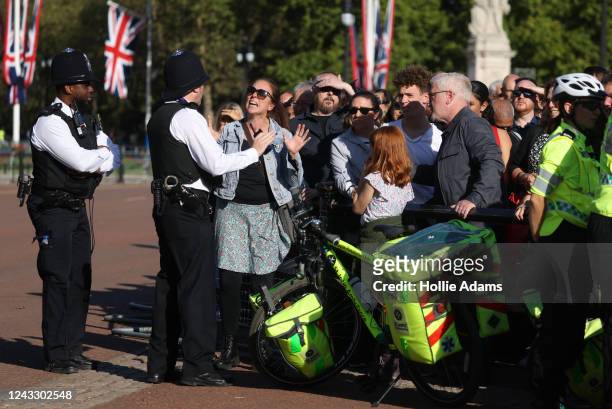Member of the public argues with police after trying to leave a crowded area at Buckingham Palace on September 17, 2022 in London, United Kingdom....