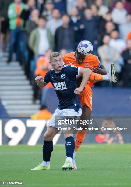 Blackpool's Marvin Ekpiteta battles with Millwall's Zian Flemming during the Sky Bet Championship between Millwall and Blackpool at The Den on...