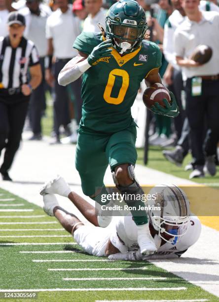 Craig Williams of the Baylor Bears carries the ball for a touchdown as Kordell Rodgers of the Texas State Bobcats defends in the first half at McLane...