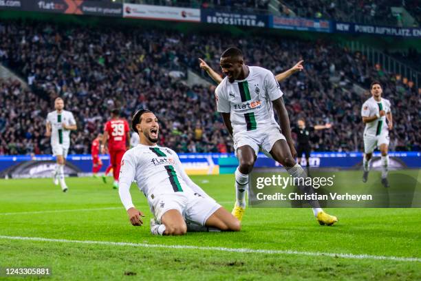 The Team of Borussia Moenchengladbach celebrates after Ramy Bensebaini scored his team's third goal during the Bundesliga match between Borussia...