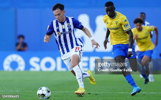 Pepe of FC Porto with Mor Ndiaye of GD Estoril Praia in action during the Liga Bwin match between GD Estoril Praia and FC Porto at Estadio Antonio...