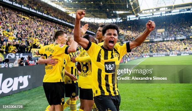 Youssoufa Moukoko of Borussia Dortmund cheers after scoring his opening goal with Karim Adeyemi of Borussia Dortmund during the Bundesliga match...