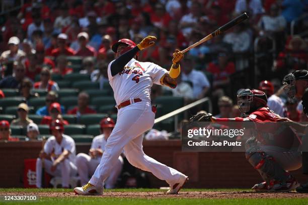 Yadier Molina of the St. Louis Cardinals hits a two-run home run against the Cincinnati Reds in the third inning in game one of a double header at...