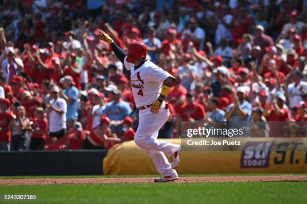 Yadier Molina of the St. Louis Cardinals reacts after hitting a two-run home run against the Cincinnati Reds in the third inning in game one of a...