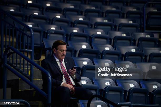 MyPillow CEO Mike Lindell checks his cellphone inside the Covelli Centre before a Save America Rally, featuring former President Donald Trump, to...