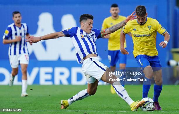 Rodrigo Martins of GD Estoril Praia with Matheus Uribe of FC Porto in action during the Liga Bwin match between GD Estoril Praia and FC Porto at...