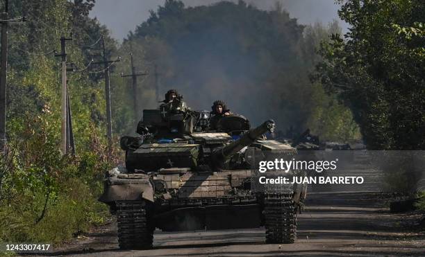 Ukrainian soldiers ride a tank in Novoselivka, on September 17 as the Russia-Ukraine war enters its 206th day.