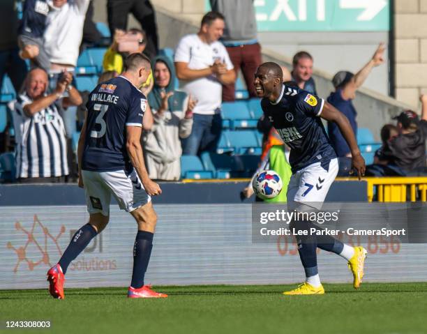 Millwall's Benik Afobe celebrates scoring his side's second goal with team-mate Murray Wallace during the Sky Bet Championship between Millwall and...