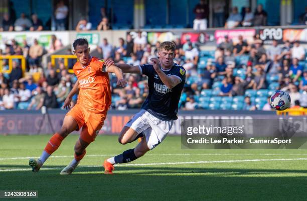 Millwall's Charlie Cresswell under pressure from Blackpool's Jerry Yates during the Sky Bet Championship between Millwall and Blackpool at The Den on...