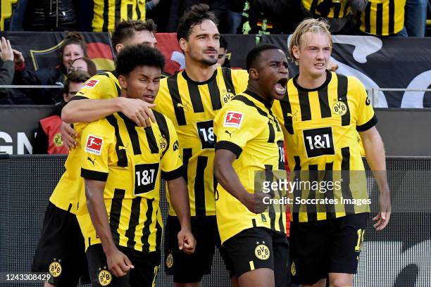 Youssoufa Moukoko of Borussia Dortmund scores the first goal to make it 1-0 and celebrates with Mats Hummels of Borussia Dortmund, Julian Brandt of...