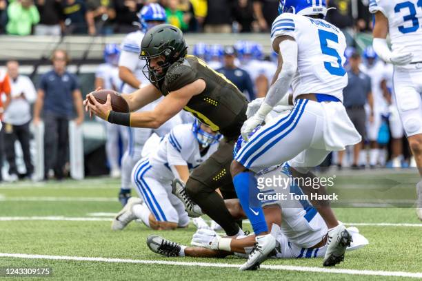 Quarterback Bo Nix of the Oregon DucksDucks dives for a touchdown during the first quarter against the Brigham Young Cougars at Autzen Stadium on...