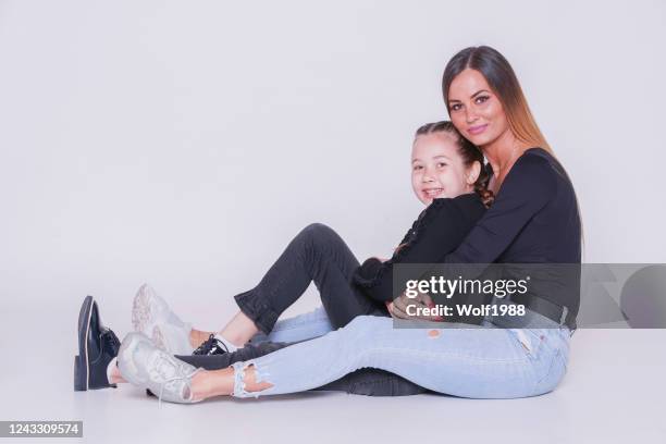 mother and daughter in studio - family photo shoot stock pictures, royalty-free photos & images