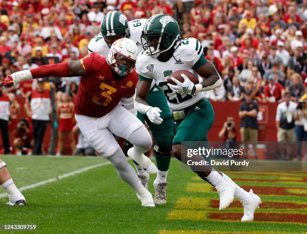 Running back Sieh Bangura of the Ohio Bobcats drives the ball out of the end zone as defensive lineman MJ Anderson of the Iowa State Cyclones defends...