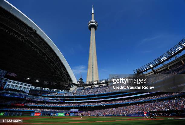 General view of Kyle Bradish of the Baltimore Orioles delivering a pitch to Teoscar Hernandez of the Toronto Blue Jays in the first inning at Rogers...