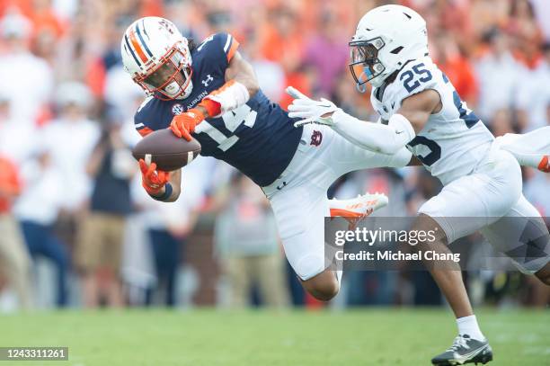 Wide receiver Landen King of the Auburn Tigers catches a pass in front of cornerback Daequan Hardy of the Penn State Nittany Lions during the first...