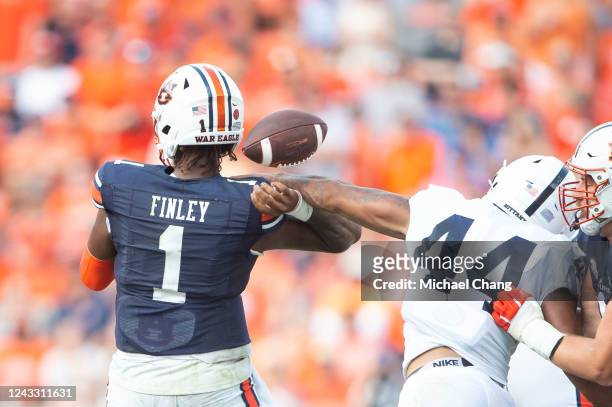 Defensive end Chop Robinson of the Penn State Nittany Lions causes a fumble after hitting the arm of quarterback T.J. Finley of the Auburn Tigers at...