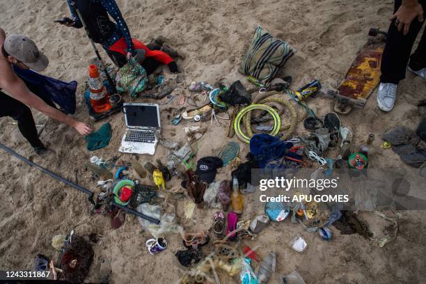 Laptop and cellphone found in the ocean by divers who were volunteering to pick up trash on the beach during International Coastal Cleanup Day in...