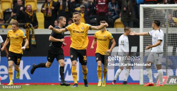 Stefan Kutschke of Dresden celebrates the opening goal with teammates during the 3.Liga match between SG Dynamo Dresden and FC Ingolstadt 04 at...