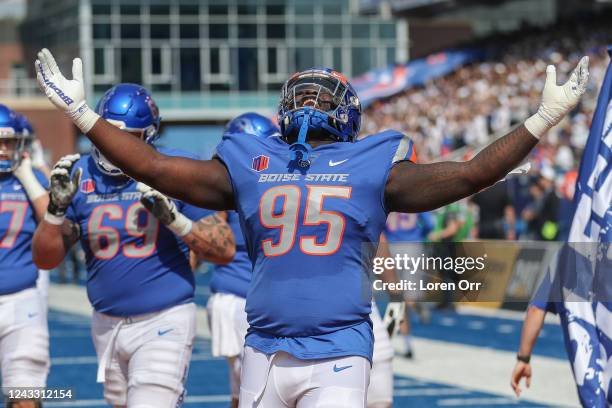 Defensive tackle Divine Obichere of the Boise State Broncos appeals to the crowd during first half action against the UT Martin Skyhawks at...