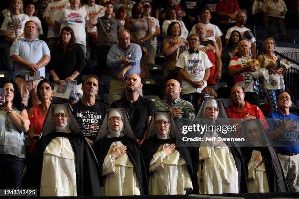 Audience members pray for their candidates before a Save America Rally at the Covelli Centre on September 17, 2022 in Youngstown, Ohio. Republican...