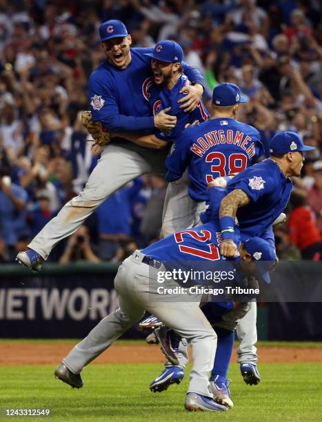 Anthony Rizzo, Kris Bryant and the Chicago Cubs celebrate an 8-7, 10-inning win against Cleveland in Game 7 of the World Series on Nov. 2 in...