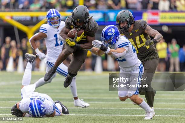 Running back Noah Whittington of the Oregon Ducks leaps against the Brigham Young Cougars during the second half at Autzen Stadium on September 17,...
