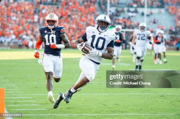 Running back Nicholas Singleton of the Penn State Nittany Lions runs the ball past of safety Zion Puckett of the Auburn Tigers for a touchdown during...