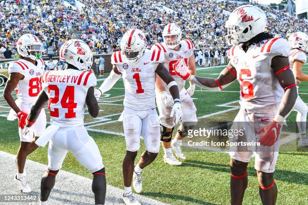 Ole Miss wide receiver Jonathan Mingo congratulates Ole Miss running back Ulysses Bentley IV after Bentley scored a touchdown during the NCAA...