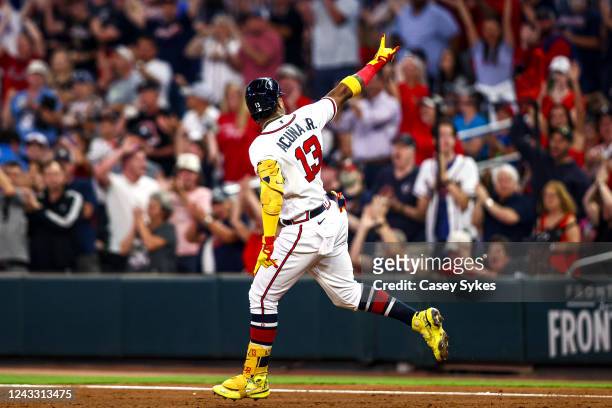 Ronald Acuña Jr. #13 of the Atlanta Braves celebrates after hitting a two-run home run off of Aaron Nola of the Philadelphia Phillies in the bottom...