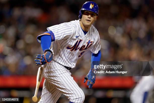 Brandon Nimmo of the New York Mets drops his bat after being walked with the bases loaded during the sixth inning against the Pittsburgh Pirates at...