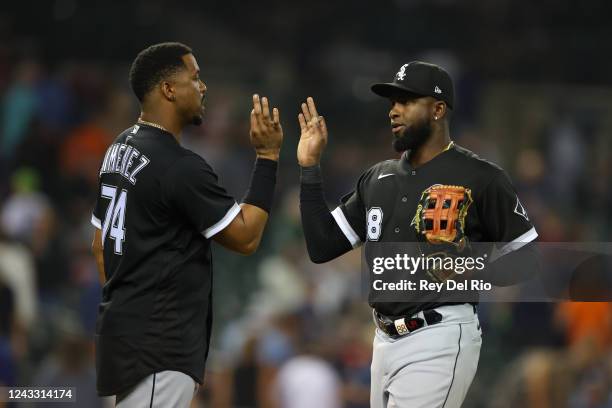 Luis Robert of the Chicago White Sox celebrates a 4-3 win over the Detroit Tigers with teammate Eloy Jimenez at Comerica Park on September 17, 2022...