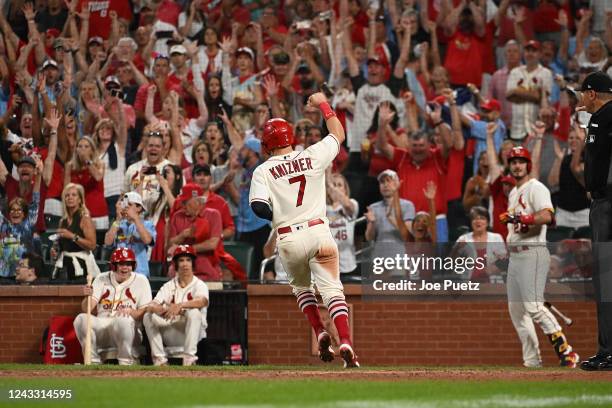 Andrew Knizner of the St. Louis Cardinals reacts after scoring the winning run against the Cincinnati Reds in the eleventh inning during the second...