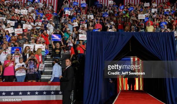 Former President Donald Trump enters the stage at a Save America Rally to support Republican candidates running for state and federal offices in the...