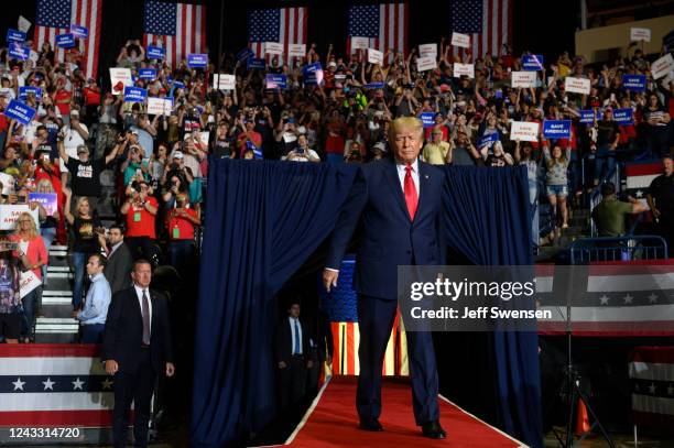 Former President Donald Trump enters the stage at a Save America Rally to support Republican candidates running for state and federal offices in the...