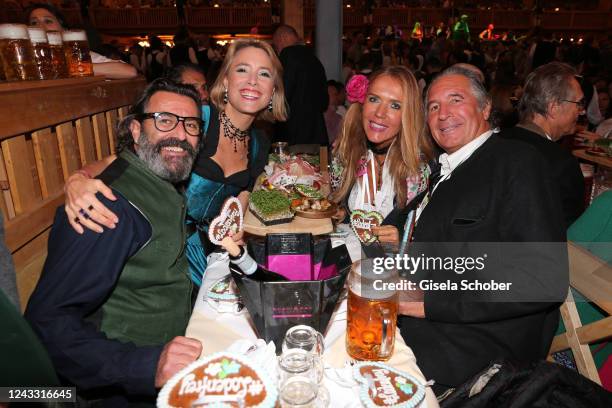 Painter Mauro Bergonzoli, Franziska Fugger von Babenhausen, Daniela Brunner and Urs Brunner during the opening day of the 187th Oktoberfest at...