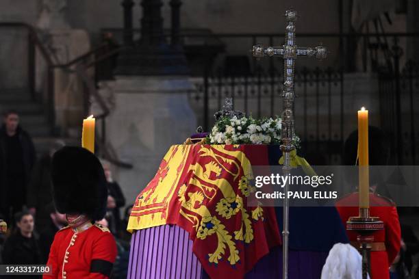 Members of the public pay their respects as they pass the coffin of Queen Elizabeth II, Lying in State inside Westminster Hall, at the Palace of...