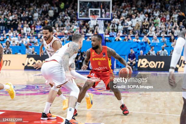 Lorenzo Brown of Spain and Daniel Theis of Germany seen in action during the semifinal of the FIBA Eurobasket 2022 between Spain and Germany at...