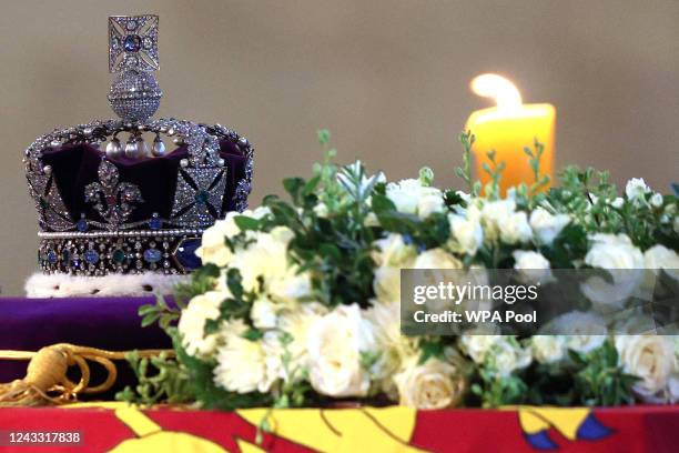 The coffin of Queen Elizabeth II, draped in the Royal Standard and adorned with the Imperial State Crown, is pictured Lying in State inside...