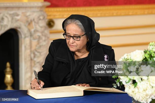 Prime Minister of Bangladesh, Sheikh Hasina Wazed, signs a book of condolence at Lancaster House on September 18, 2022 in London, United Kingdom....